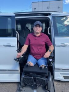 man in wheelchair accessible van